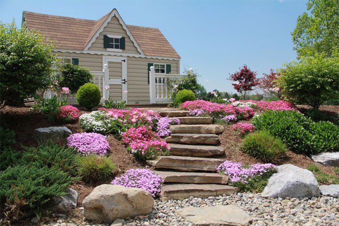 Tom Jones Landscape — House Surrounded by Flowers In Marietta, PA
