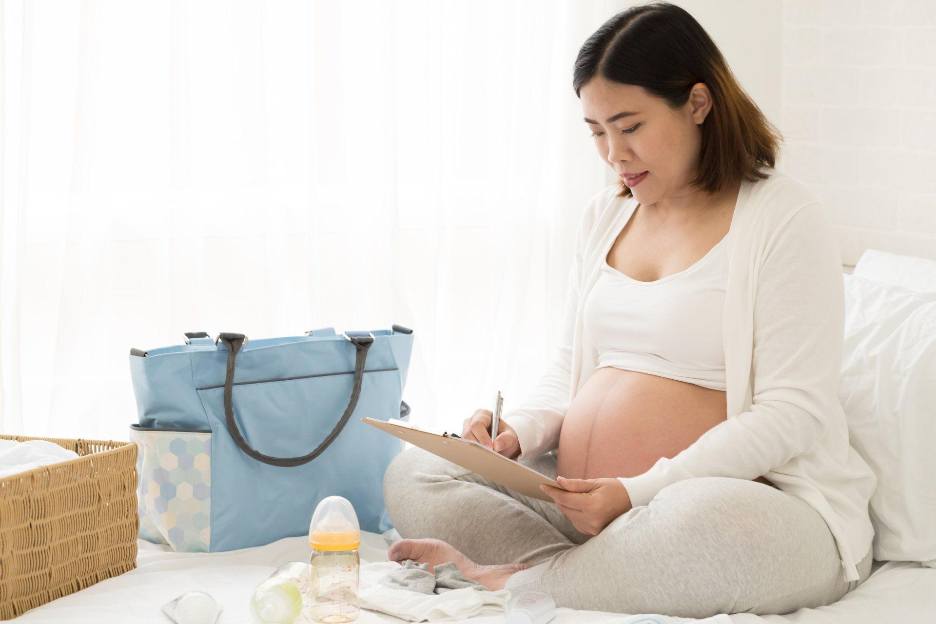 a pregnant woman going through her checklist