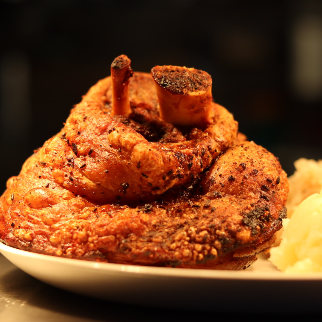 A close up of a piece of meat on a plate