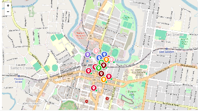 Map with several location markers, mostly red and some pink/green, clustered in a downtown area.