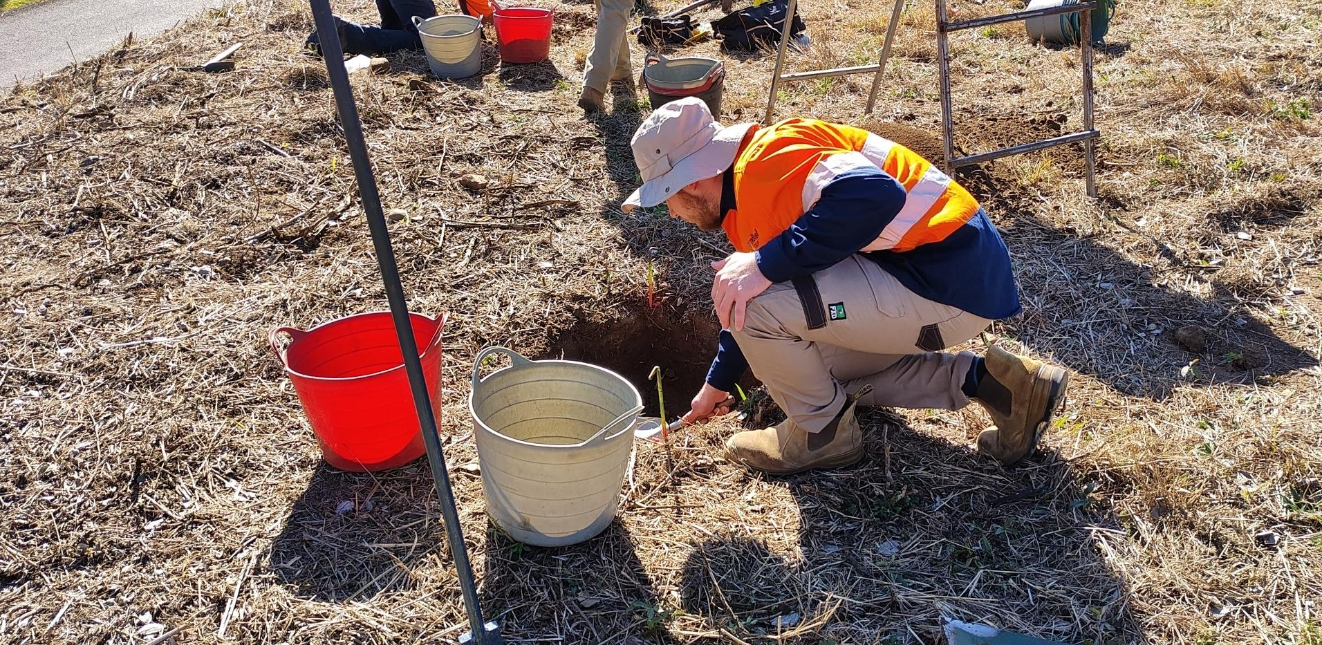 Ronan assisting with excavation of an archaeological test pit.