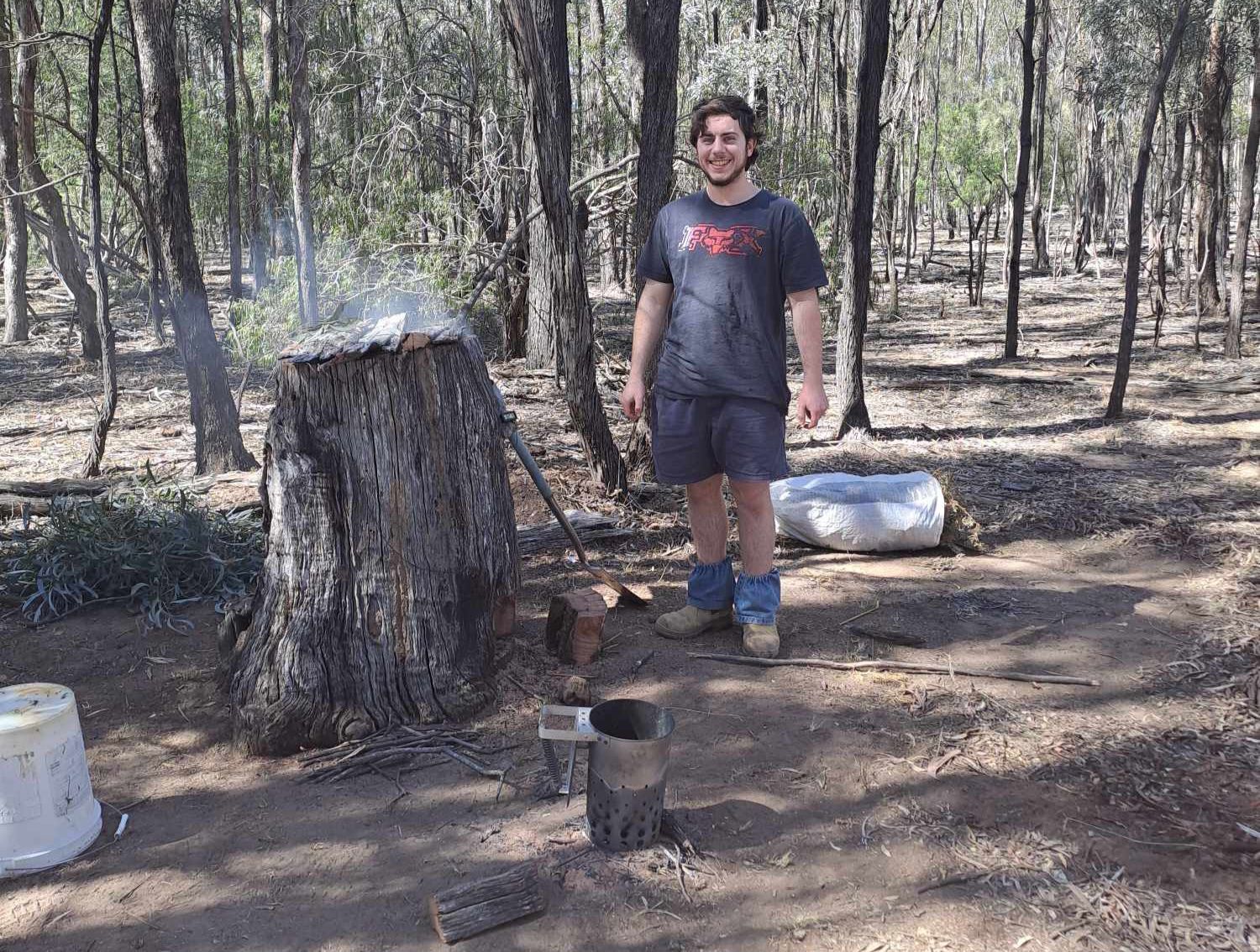 Ronan experimenting with fish smoking using techniques designed to be analogous to traditional Aboriginal methods.