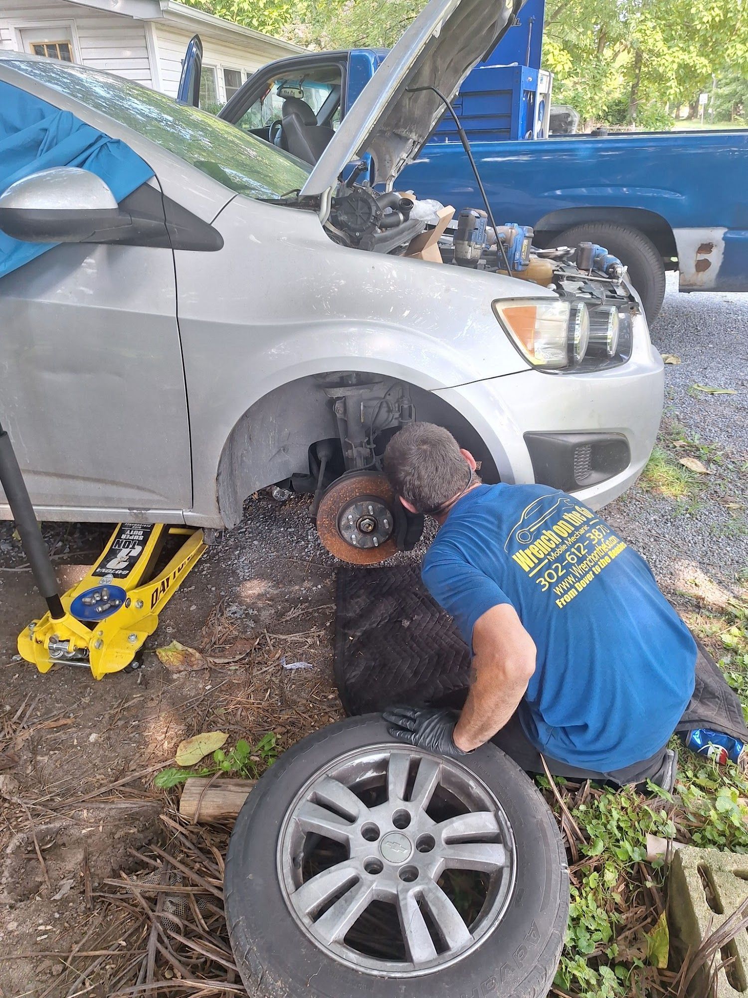 A man is working on a kitchen in a house under construction