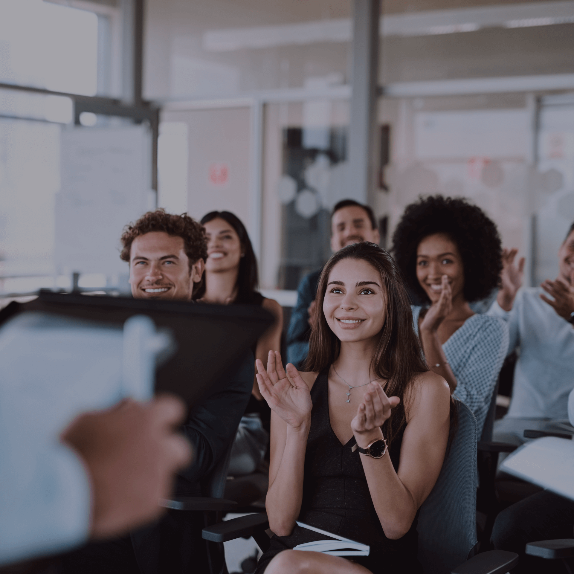 Professionals attending a presentation, symbolizing strategic impact at Gym Revival Group careers