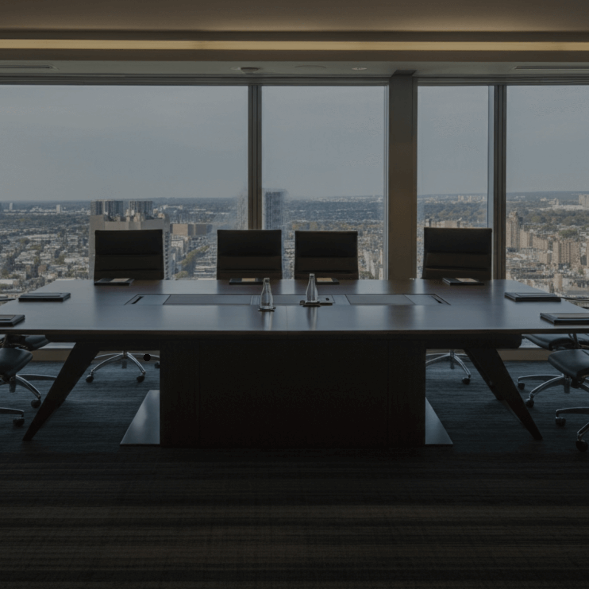Empty modern conference room with city view, symbolizing Gym Revival Group's mission of engineering elite systems.