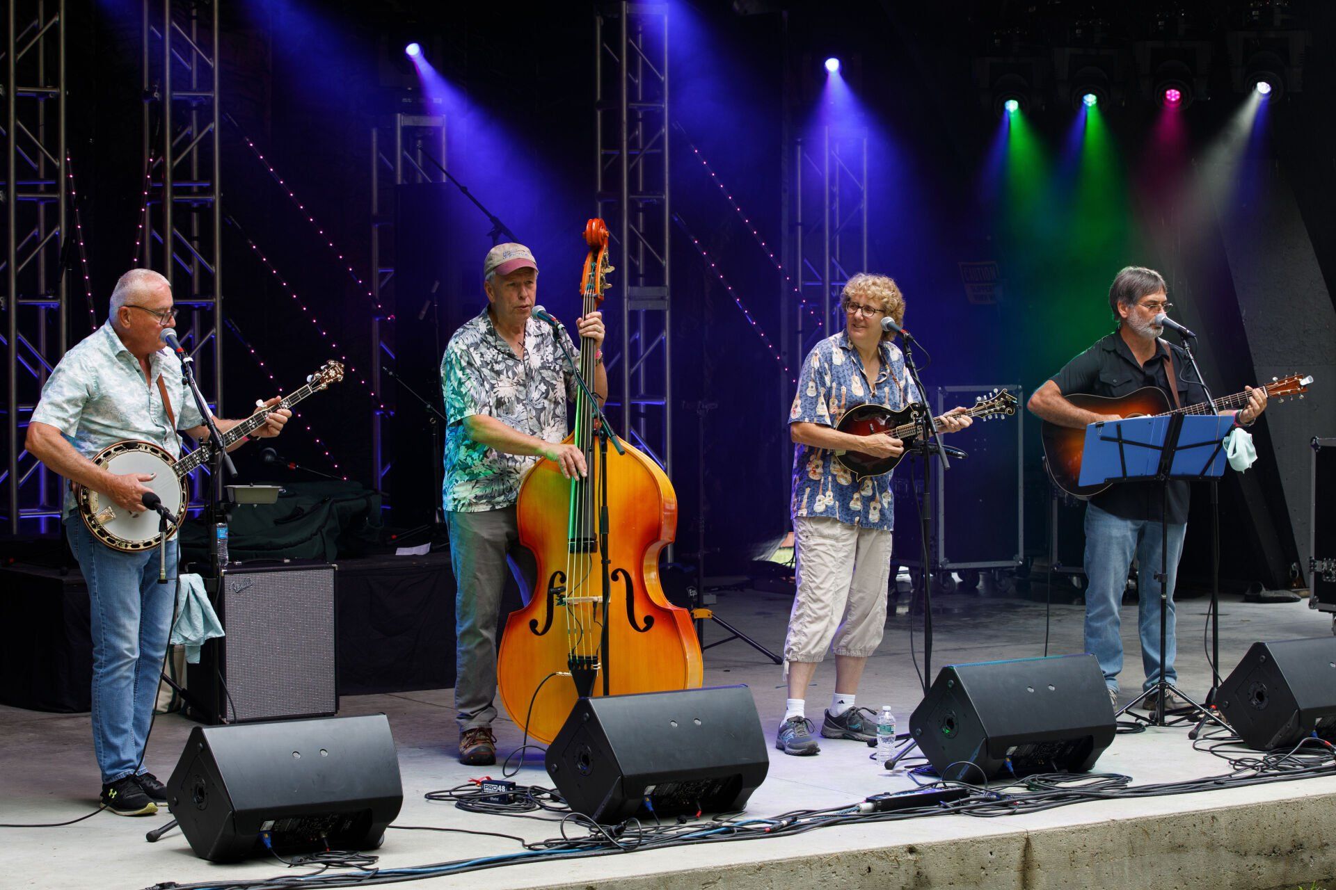 A group of men are playing instruments on a stage.
