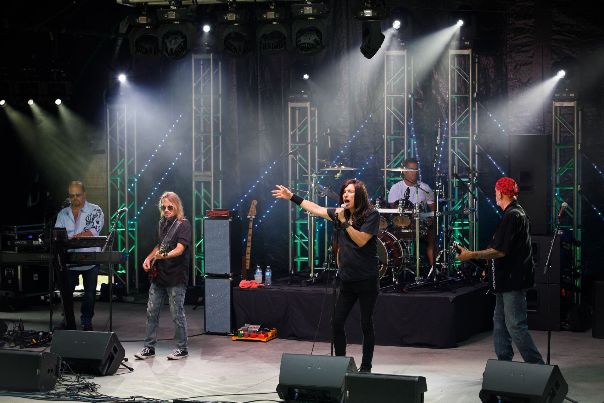 A group of men are playing instruments on a stage.