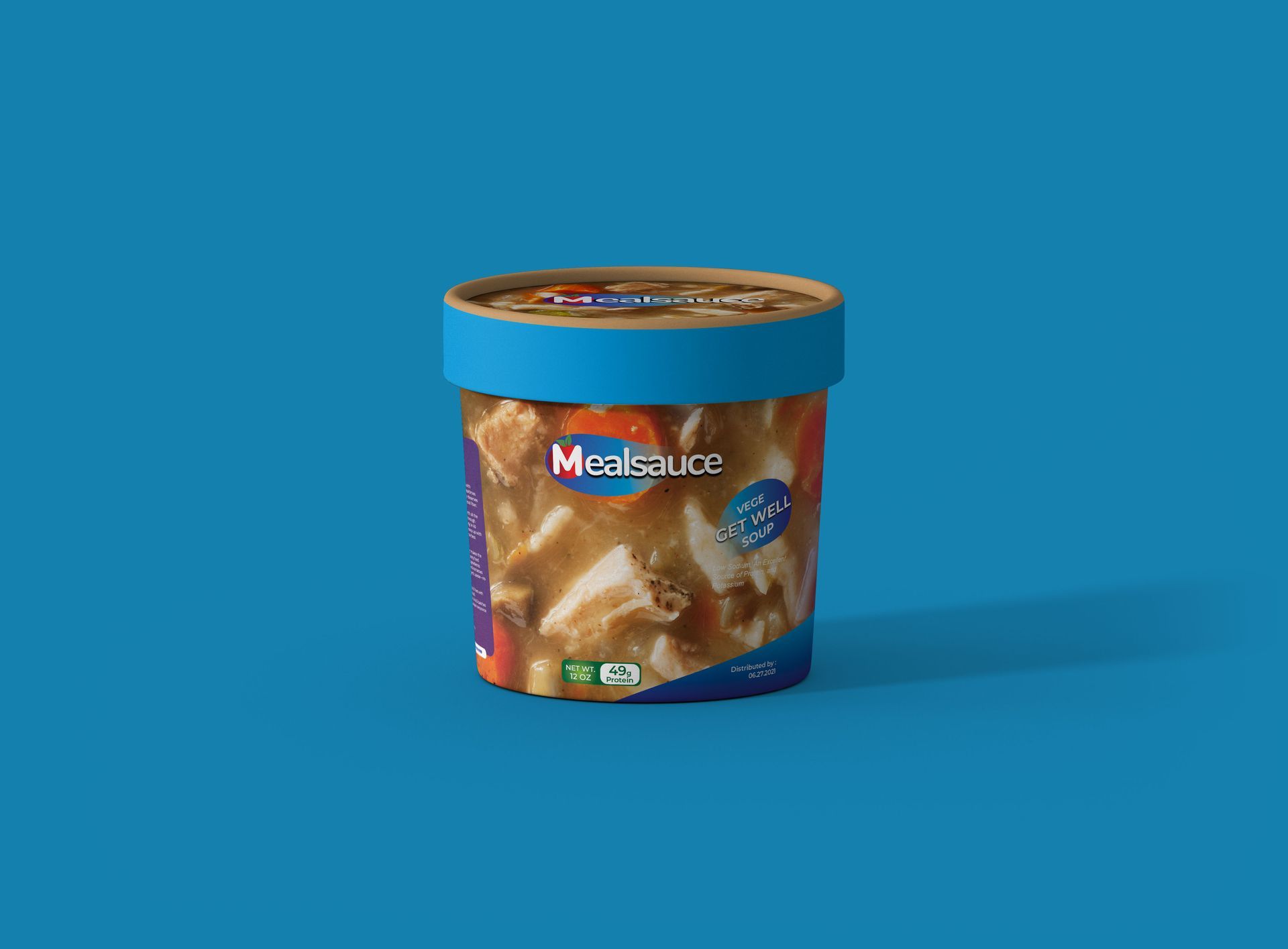 A cup of soup is sitting on a blue table.