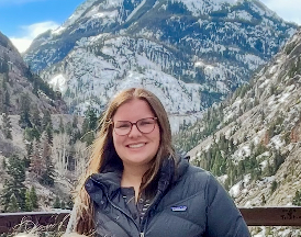 A simple, dark gray icon of a person featuring a circular head above a rounded torso, centered on a white background.
