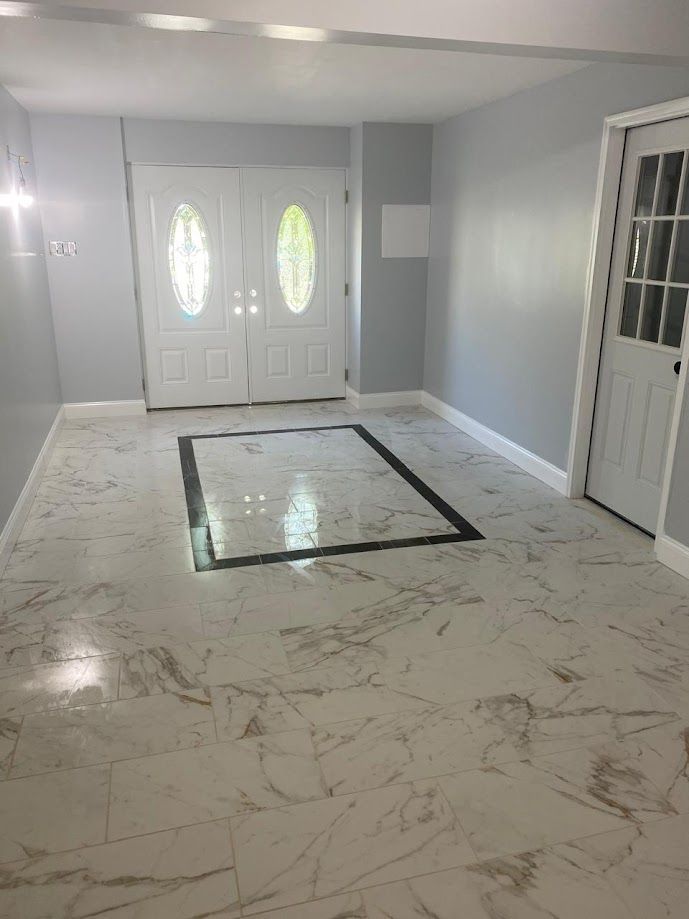 There is a marble floor in the middle of the room.