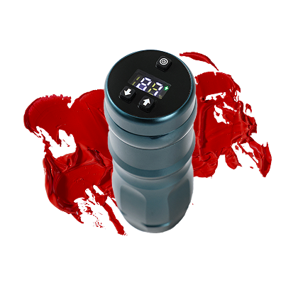 A tattoo machine is sitting next to a splash of red paint.