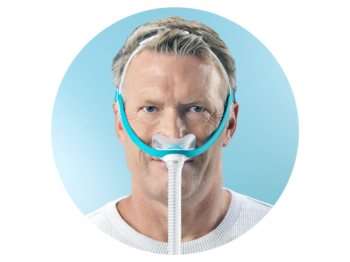 A man is wearing an oxygen mask on his nose