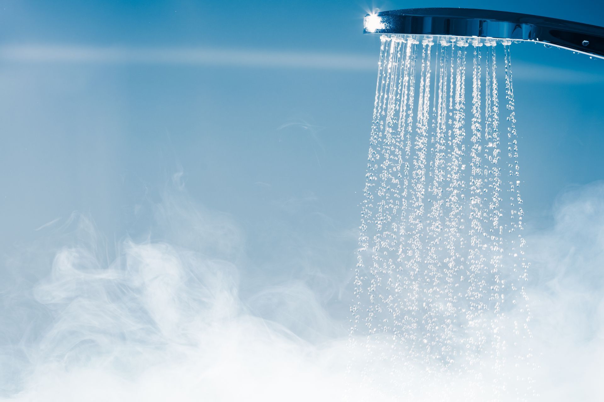 Hot shower water flowing from a showerhead, highlighting the comfort and efficiency of a Rinnai tankless water heater.