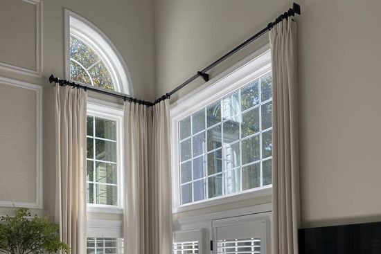 Custom curtains in a high-ceiling living room at Style Savvy Designs near Warrenton, VA