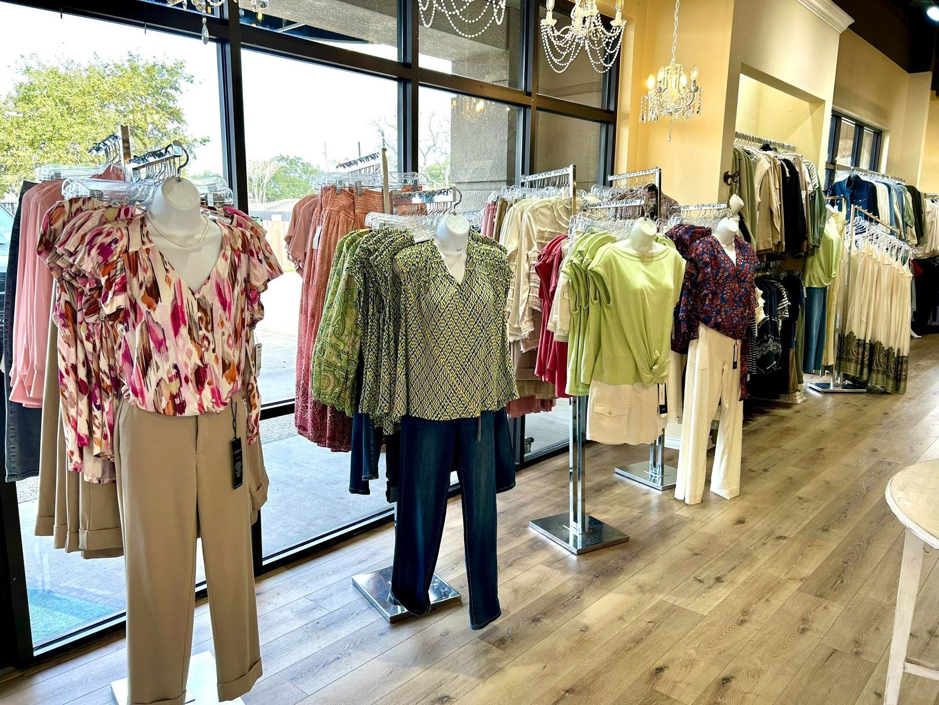 A store filled with lots of clothes on mannequins.