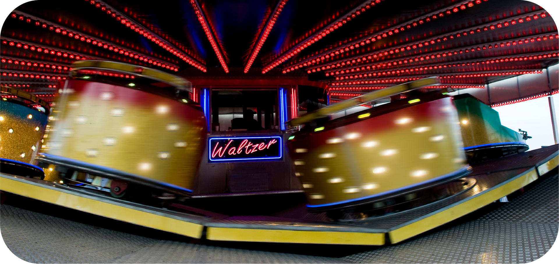 A carnival ride with a neon sign that says walter