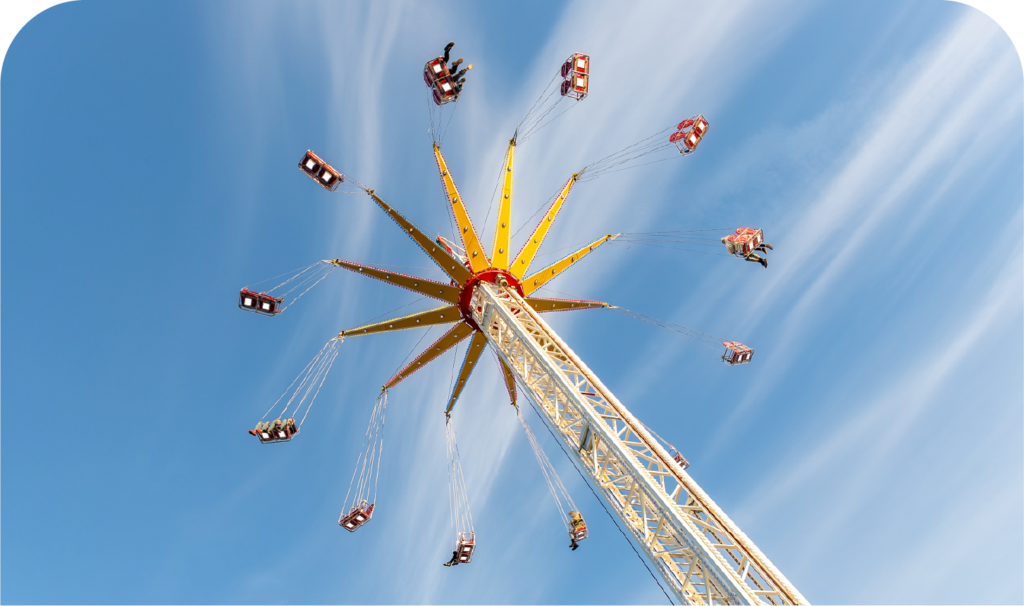 A group of people are riding a ferris wheel at an amusement park.