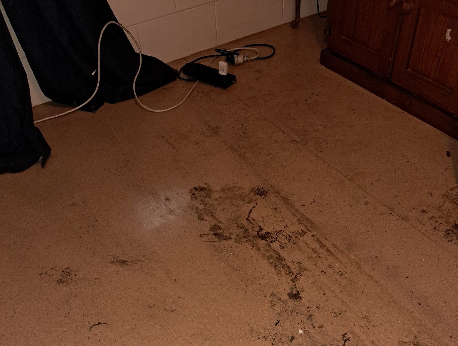A Dirty Floor With A Few Wires Laying On It — DAH Cleaning Service In Edge Hill, QLD