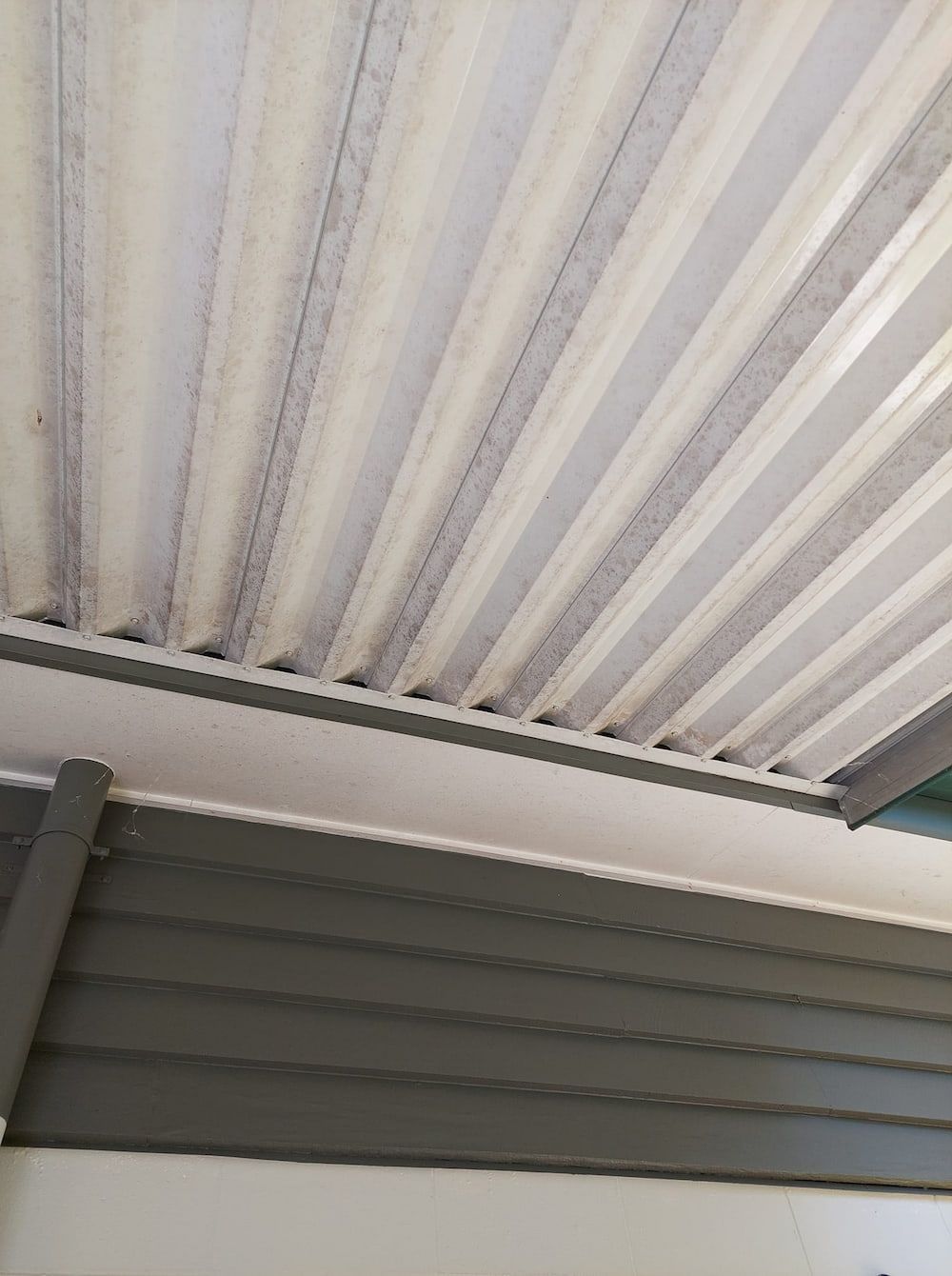 Corrugated White Roof With Gray Supports, Viewed From Below — DAH Cleaning Services In Bungalow, QLD