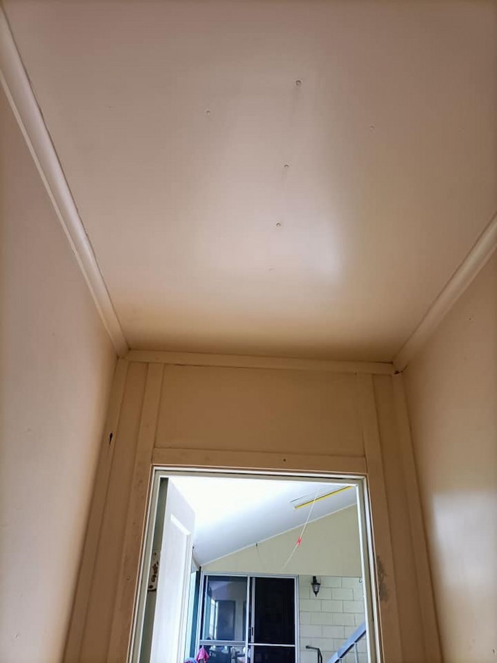 Narrow Hallway With a Light-colored Ceiling and Walls — DAH Cleaning Services In Bungalow, QLD