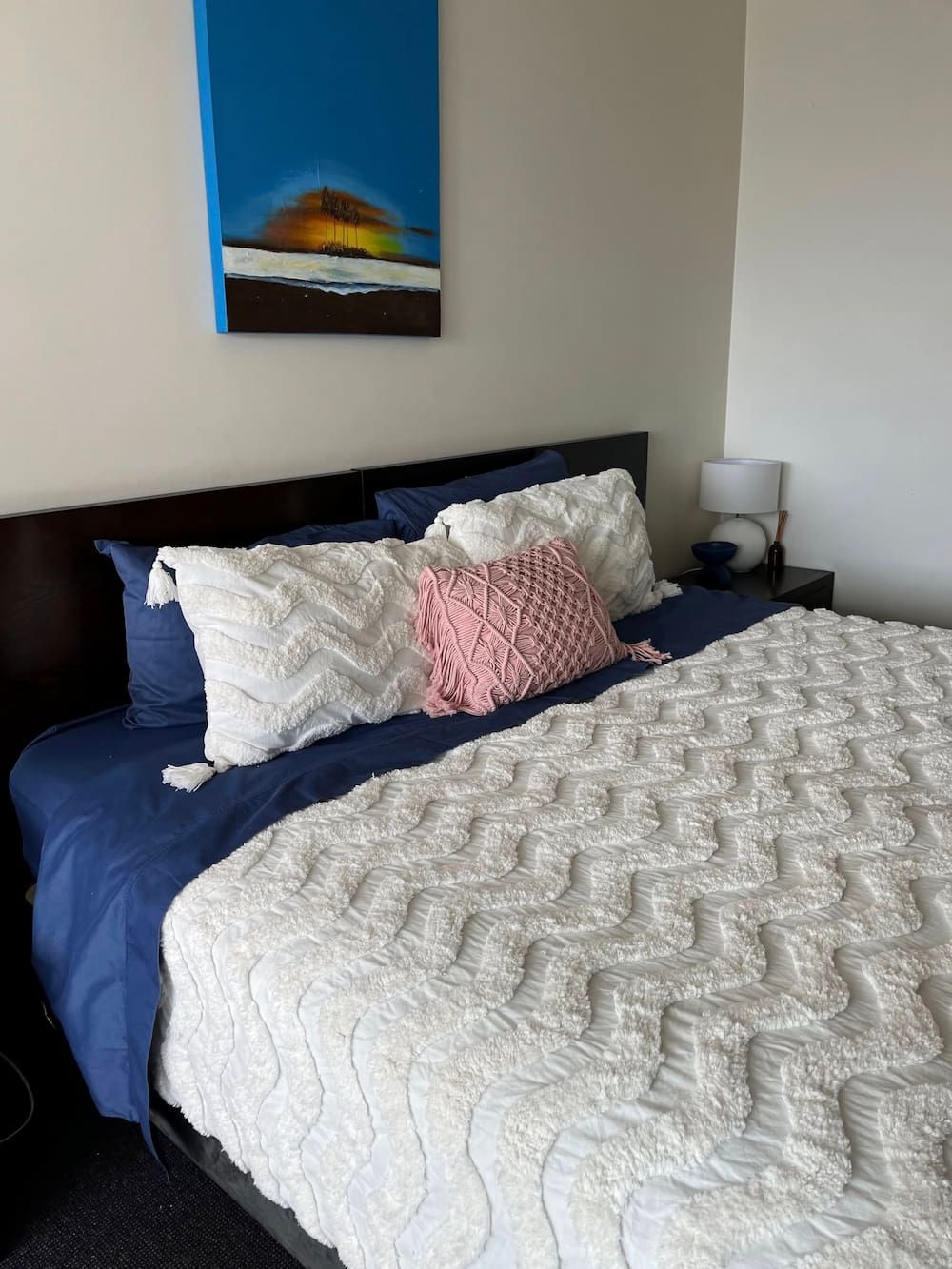 Bedroom With Blue Bedding, White Textured Blanket — DAH Cleaning Services In Bungalow, QLD