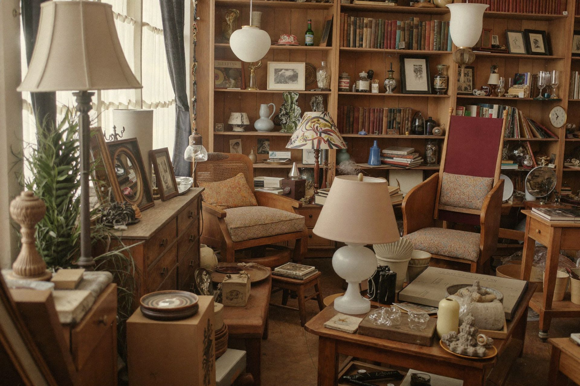 A cluttered independent antique shop interior on Cholokka Boulevard in Micanopy