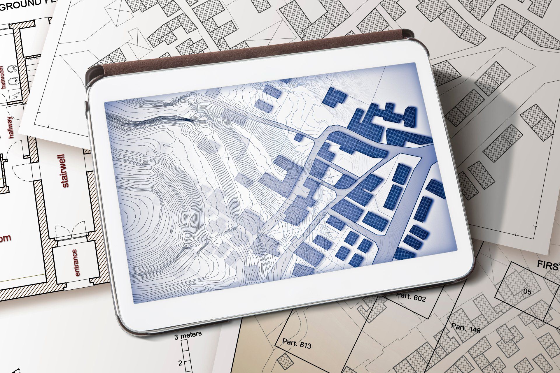 a tablet displaying a map with a subdivision plan on it