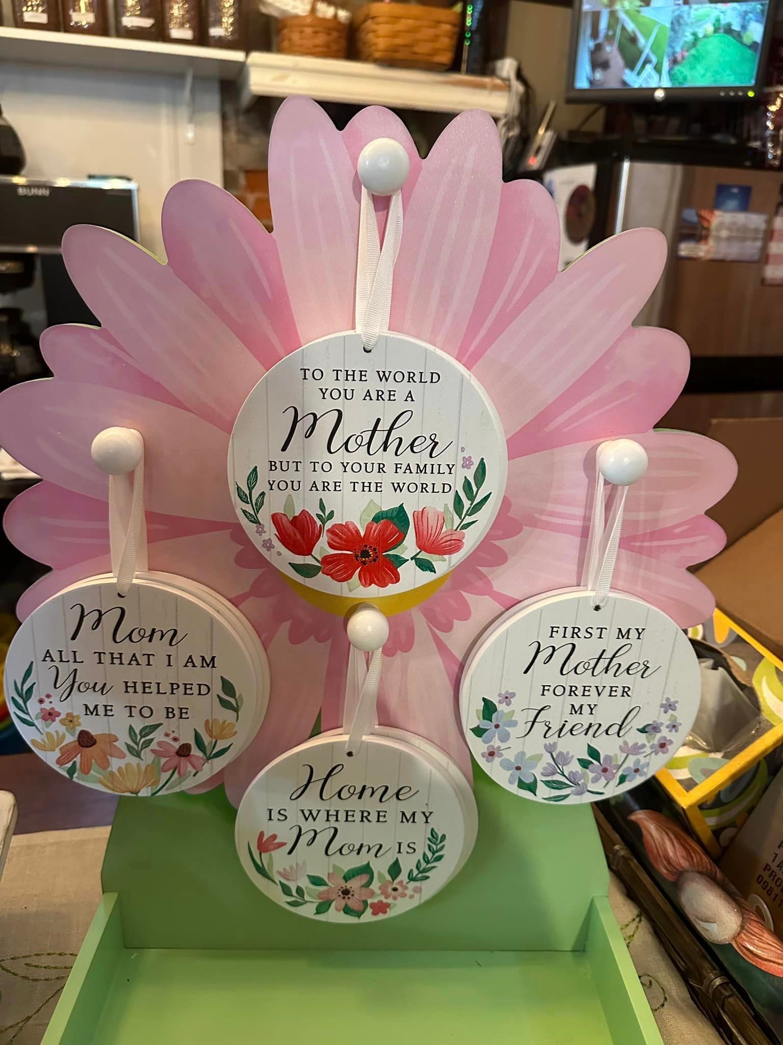 A bunch of plaques sitting on top of a pink flower.