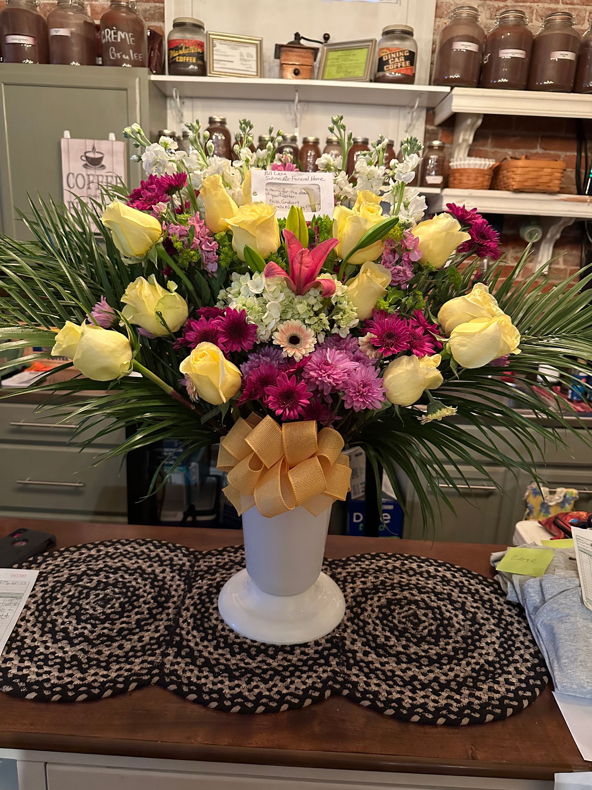A vase filled with flowers is sitting on a table.