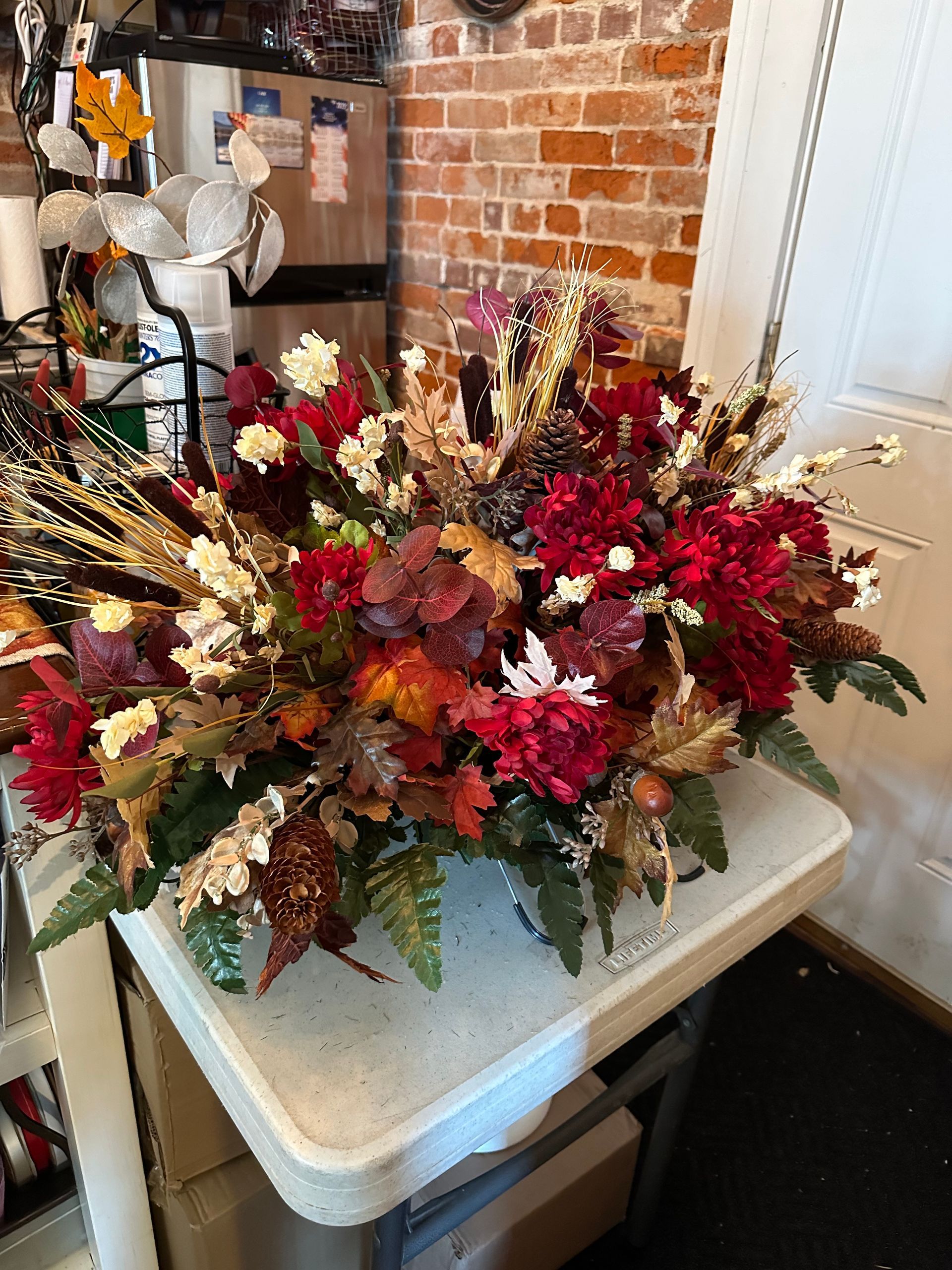 A vase of flowers is sitting on top of a white table.