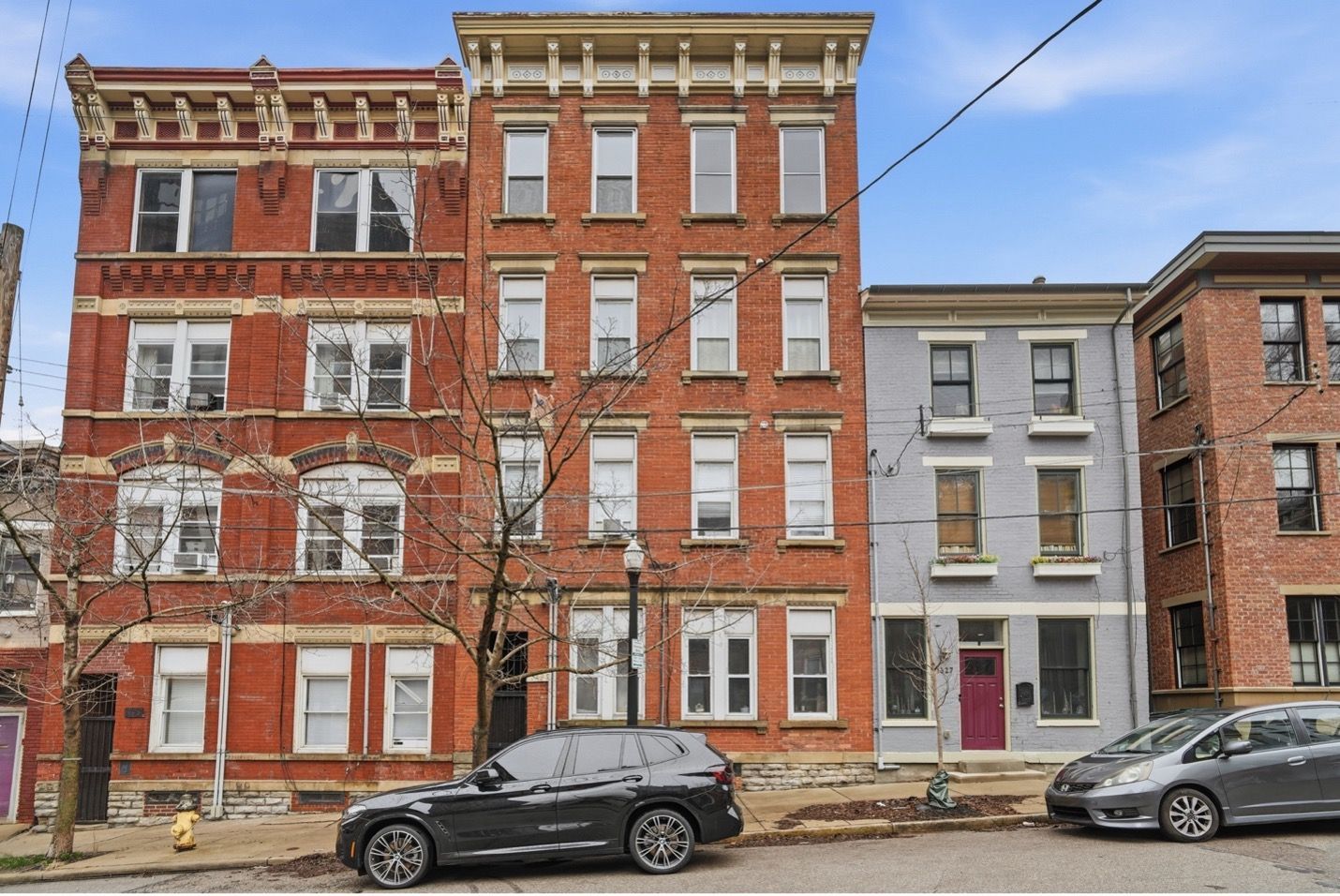 Tall apartment buildings against a dusky blue sky.
