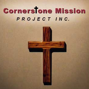 Wooden cross on a light brown wall, with text 