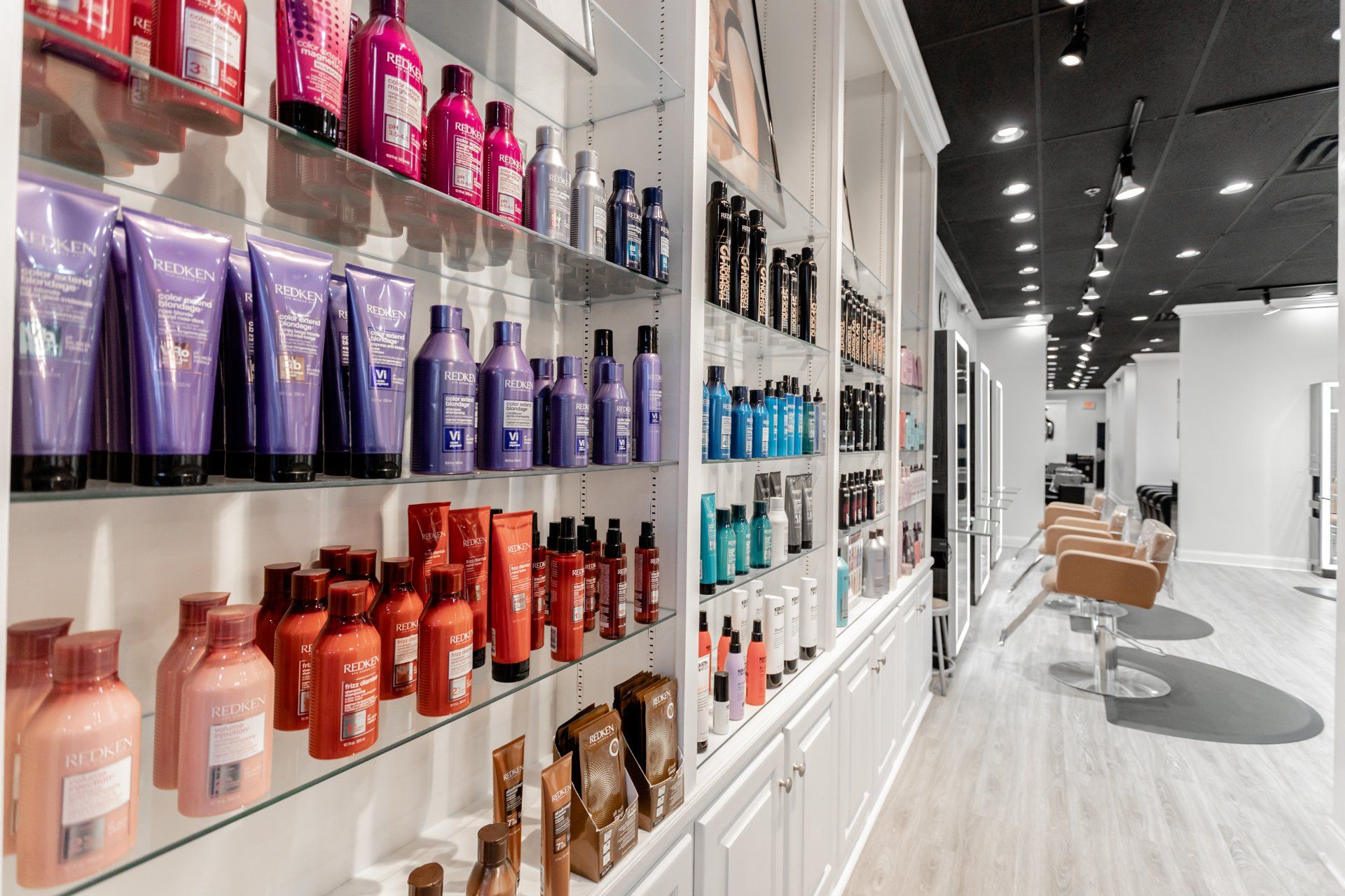 Shelf Full of Hair Products — Midlothian, VA — H H Cosmetology Institute.