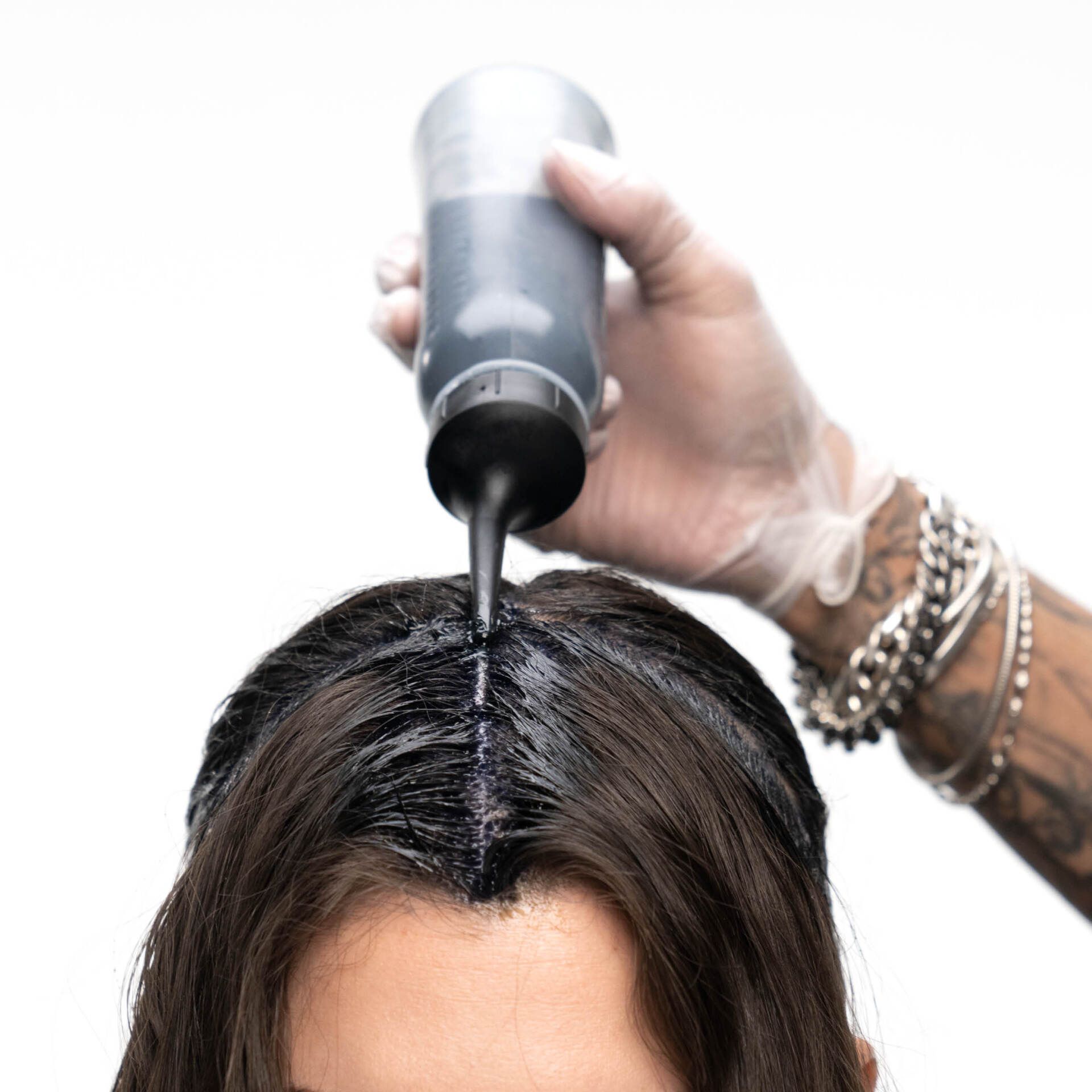 Applying Black Hair Color — Midlothian, VA — H H Cosmetology Institute.