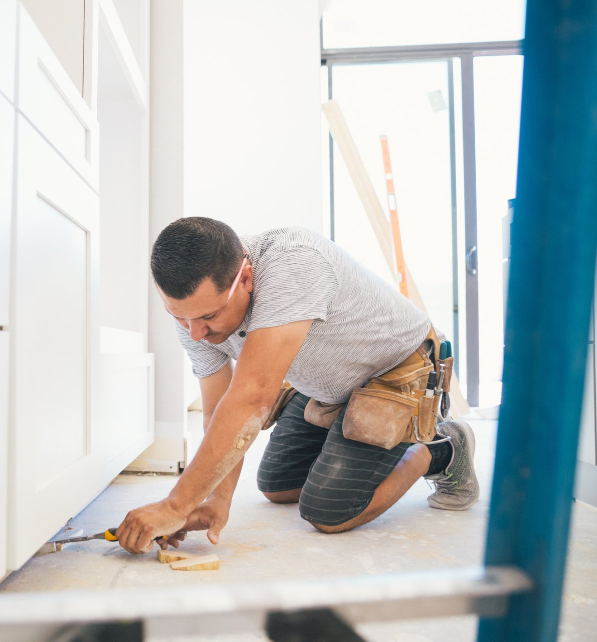 guy working on home and link to maintenance services page