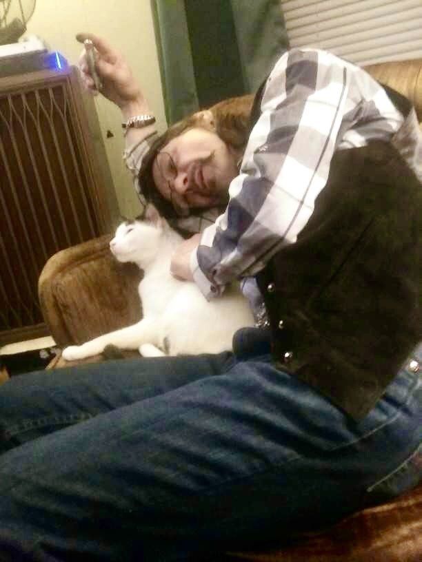 A man wearing sunglasses is sleeping