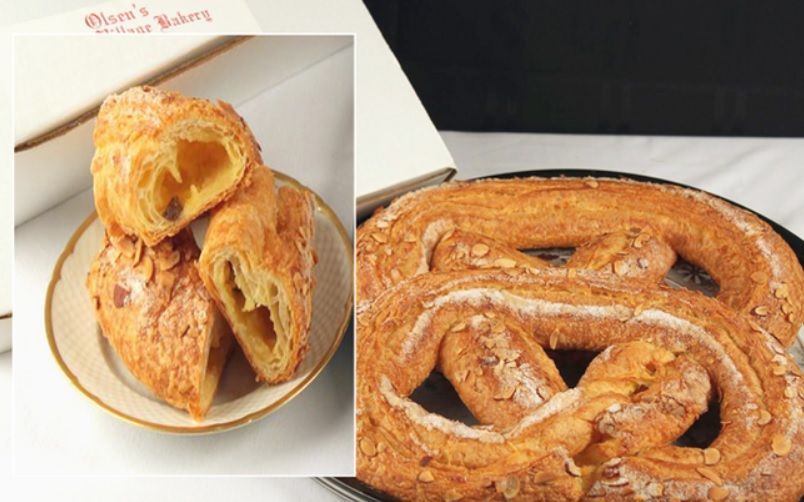 Two pastries: sliced almond croissant and a large pretzel, likely from a bakery.