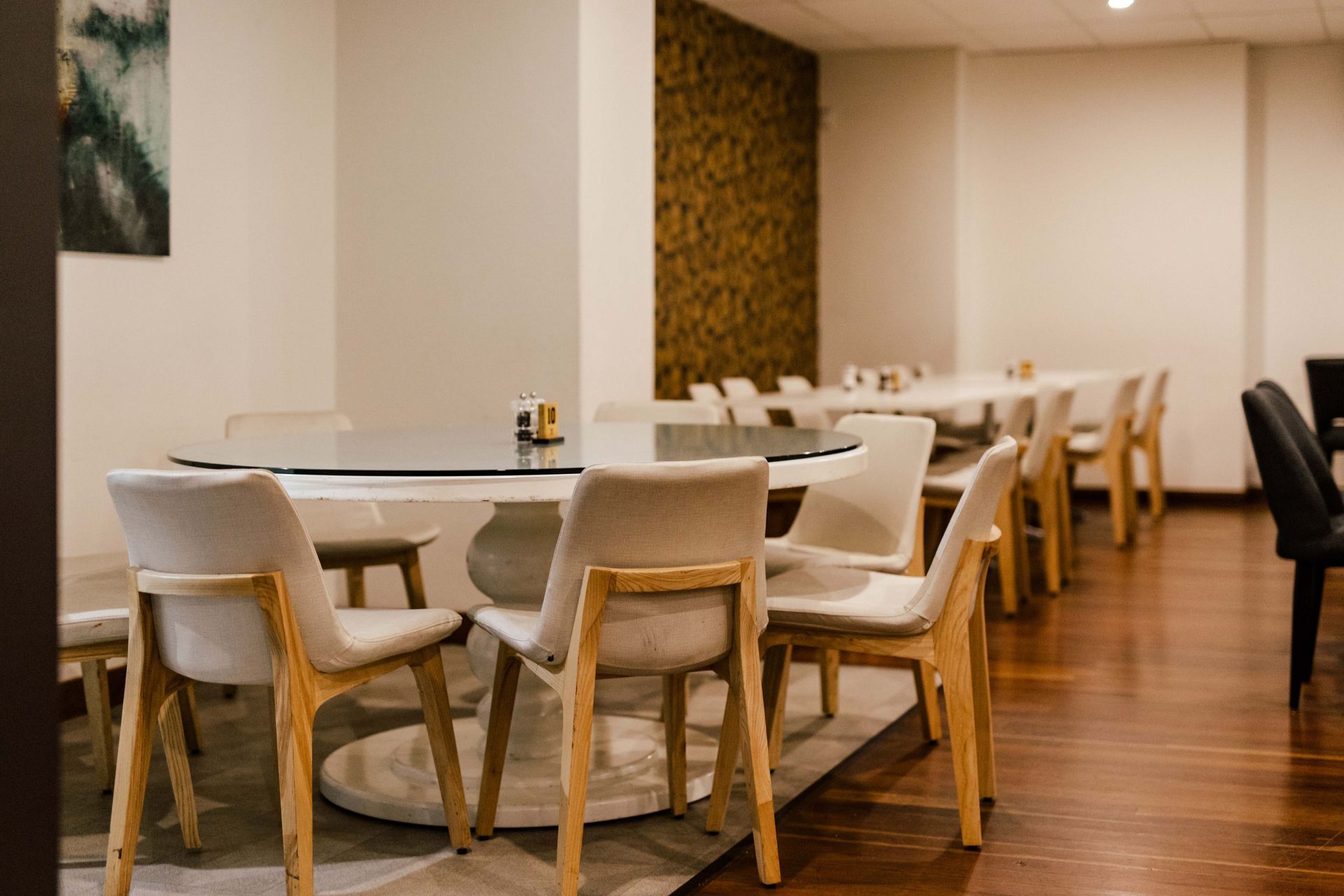 A room with a table and chairs in it