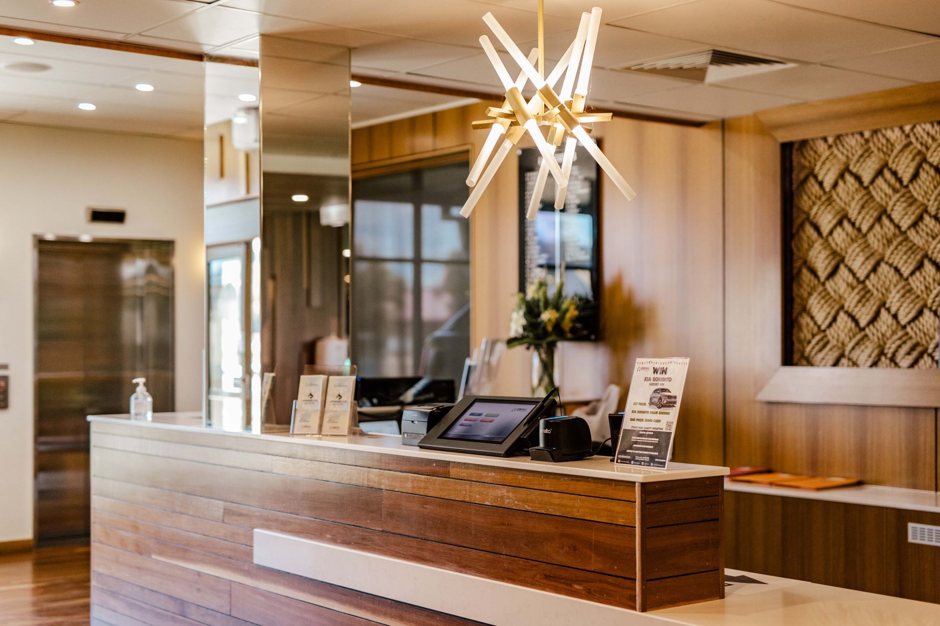 A club lobby with a wooden reception desk