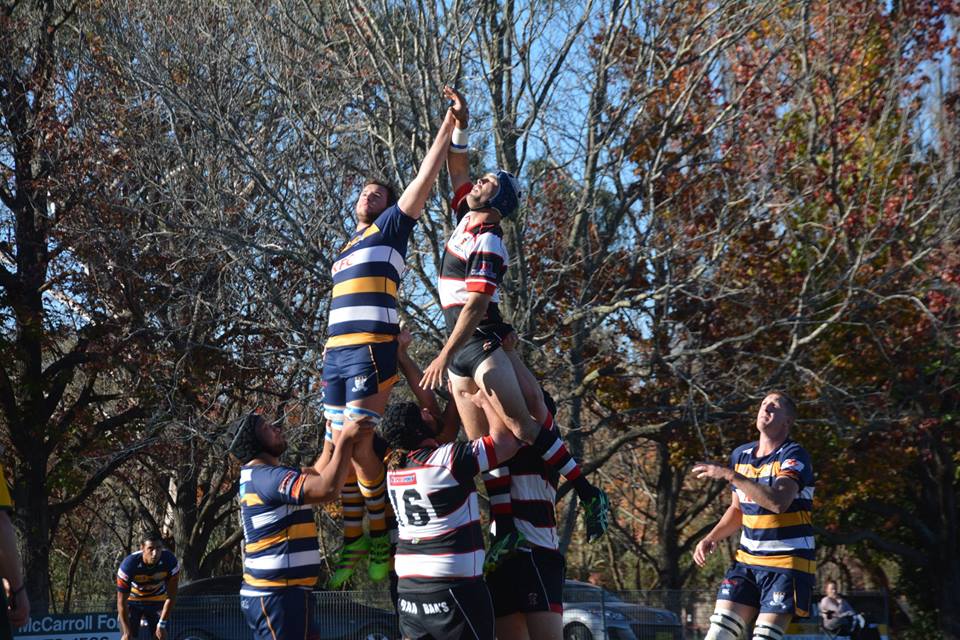 A group of men are playing rugby