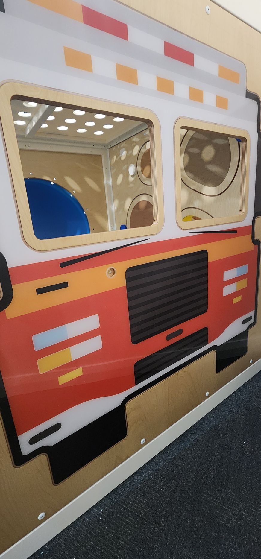 A wall with a picture of an ambulance on it