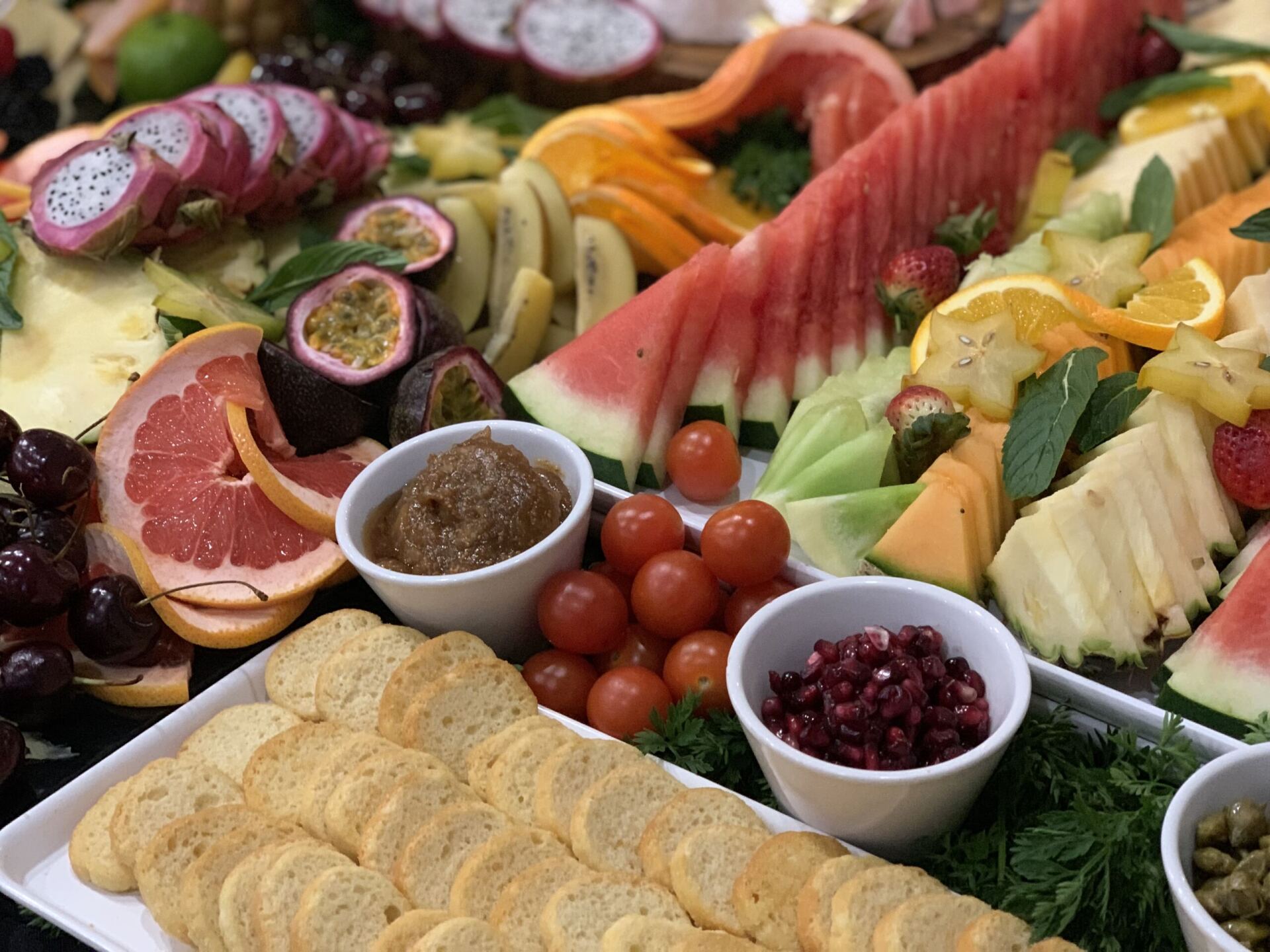 A variety of fruits and crackers on a table