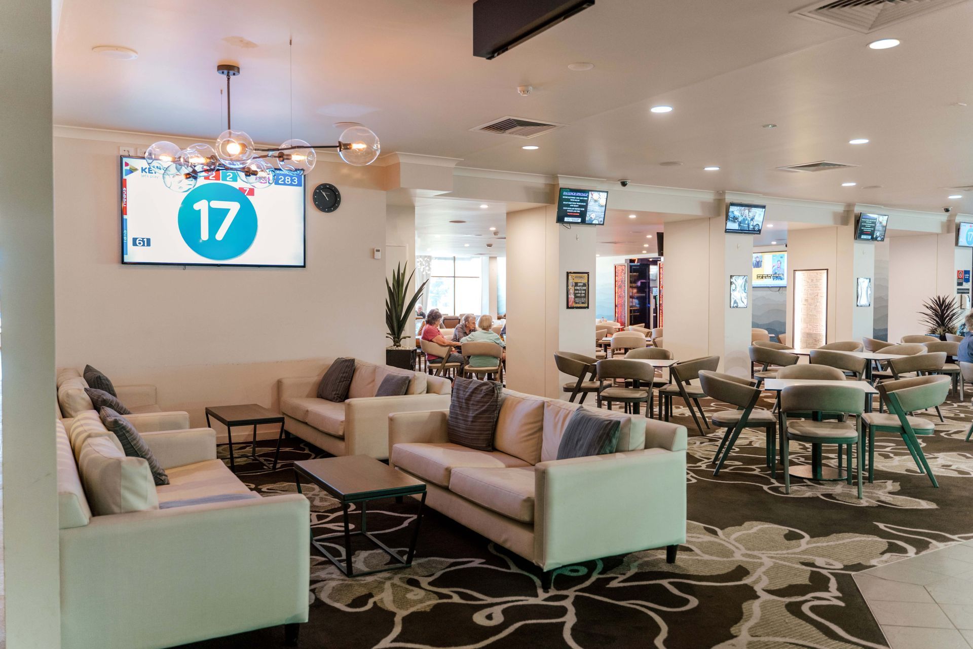 The number 17 is on a screen above the couches