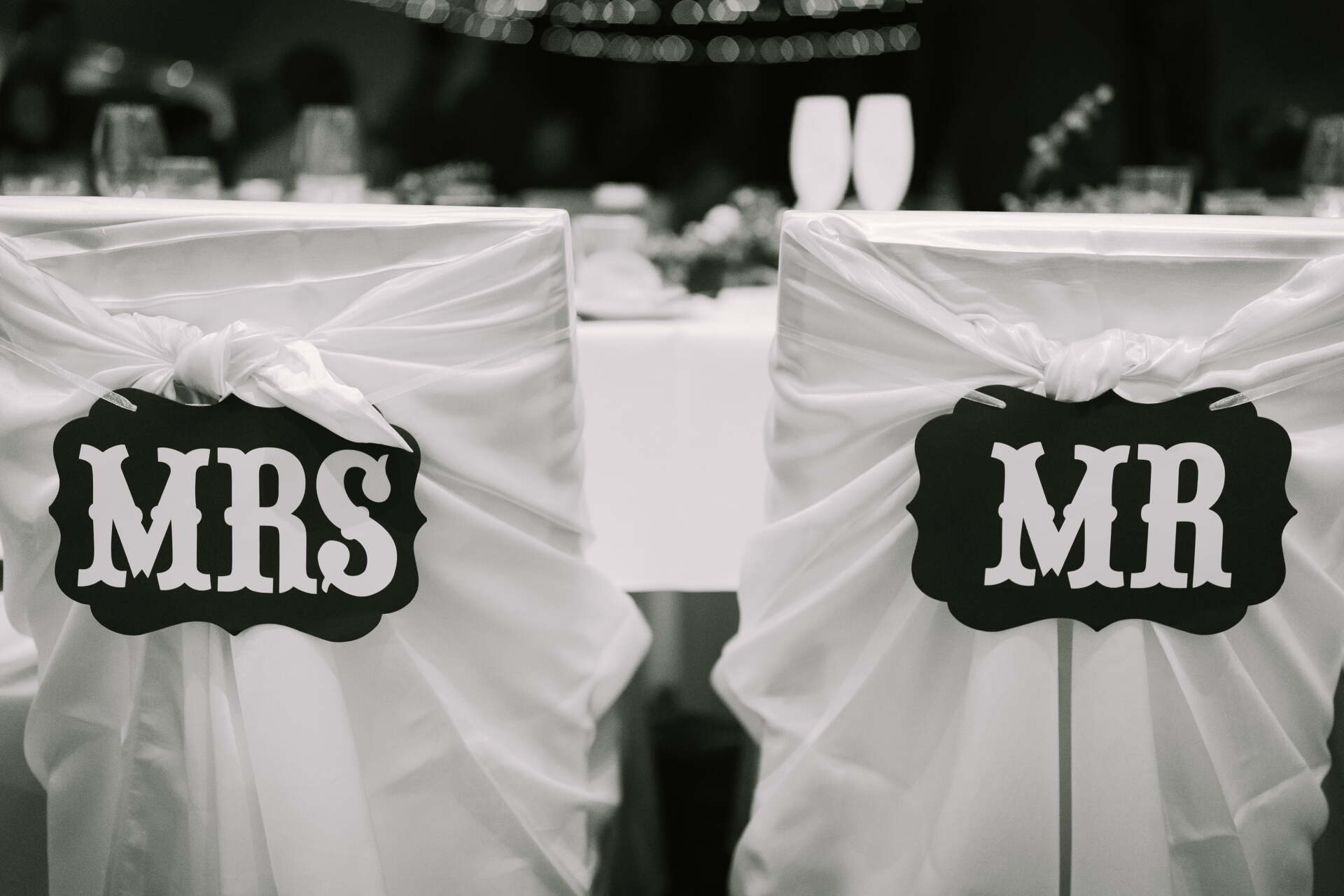 Two chairs with Mrs and Mr signs on them