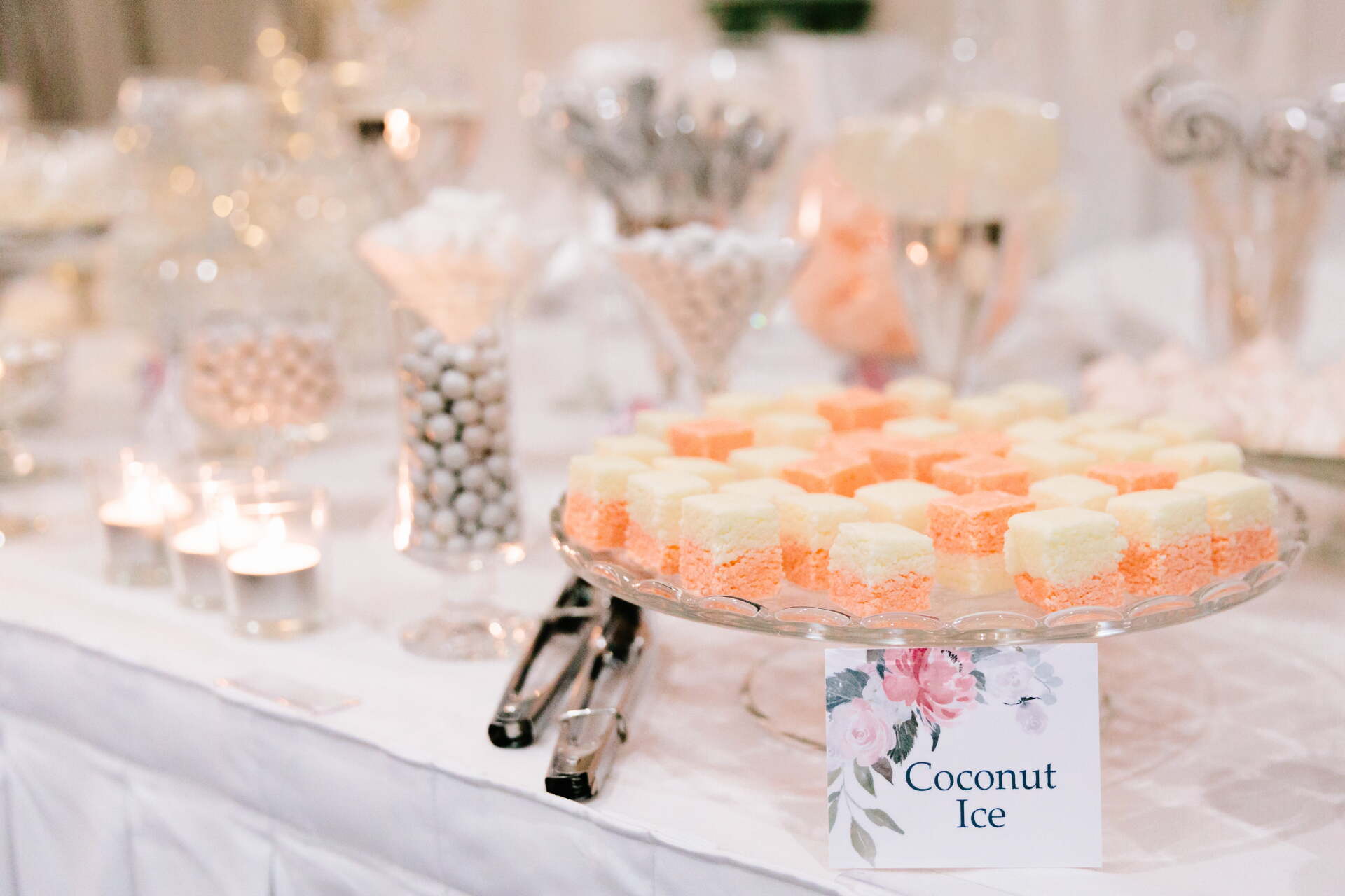 A dessert bar with a sign that says coconut ice