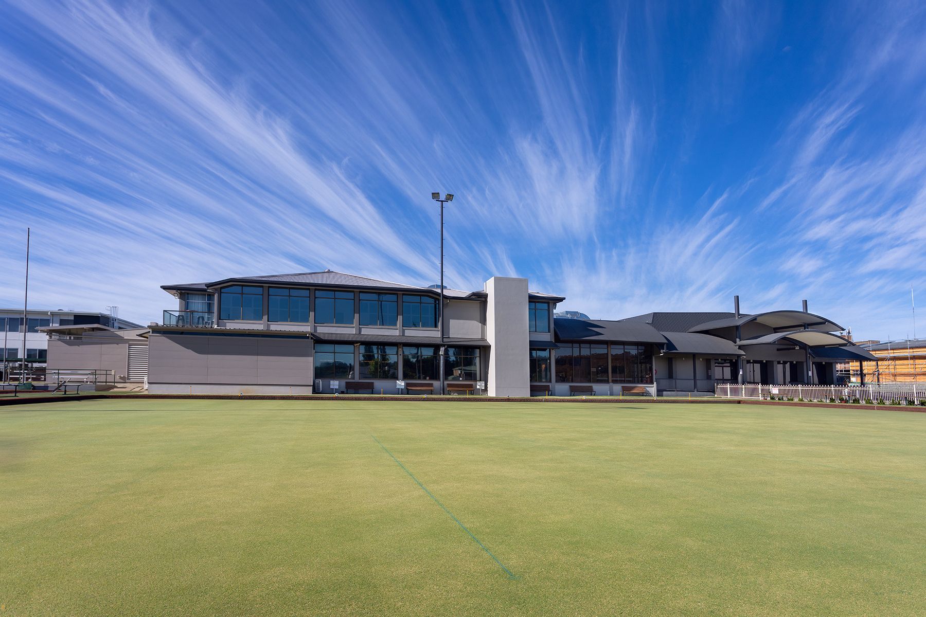 A group of people are playing a game of lawn bowling