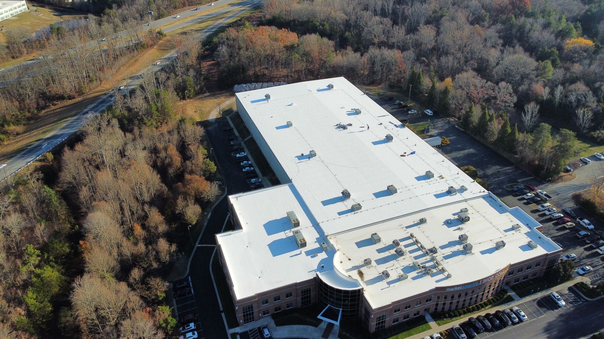Giant Commercial TPO Roofing project completed on market america building in greensboro nc by Escalade Roofing 