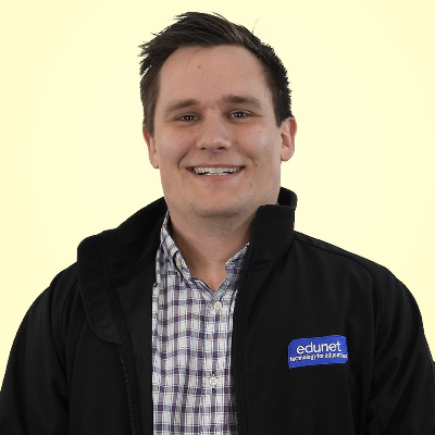 a man wearing a black jacket with the word edunet on it