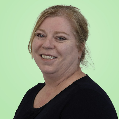 a woman in a black shirt is smiling for the camera