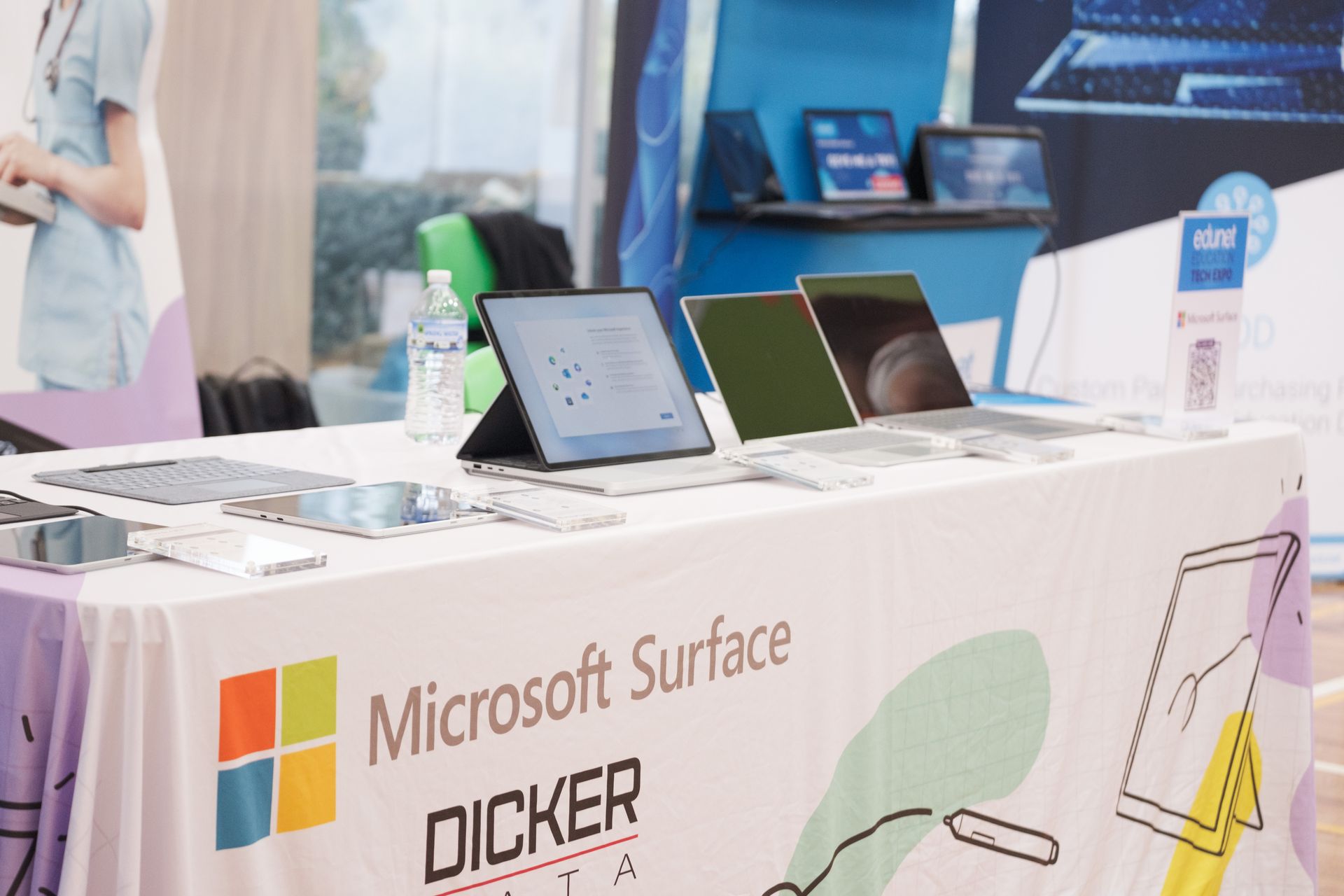 a group of people are standing around a table that says coffee on cue .